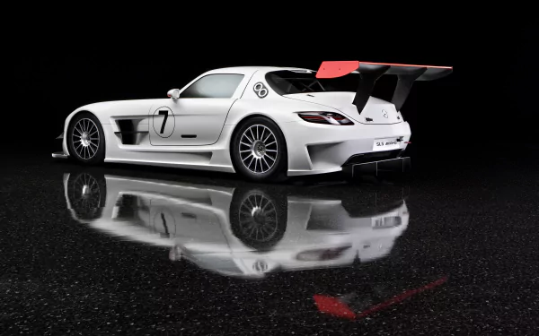 A white Mercedes-Benz SLS AMG sports car with a large rear wing, showcased on a reflective black surface in 4K Ultra HD resolution.