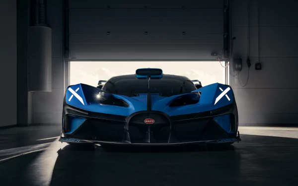 Front view of a blue Bugatti Bolide supercar in a dimly lit garage, captured in stunning 8K Ultra HD for a PC desktop wallpaper background.