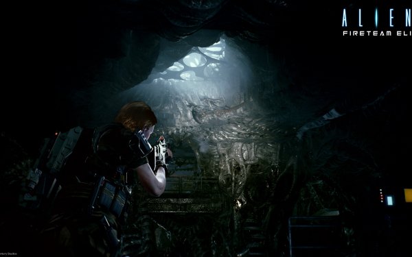 Aliens: Fireteam Elite HD Wallpaper featuring a marine exploring a dark, alien-infested cave environment.