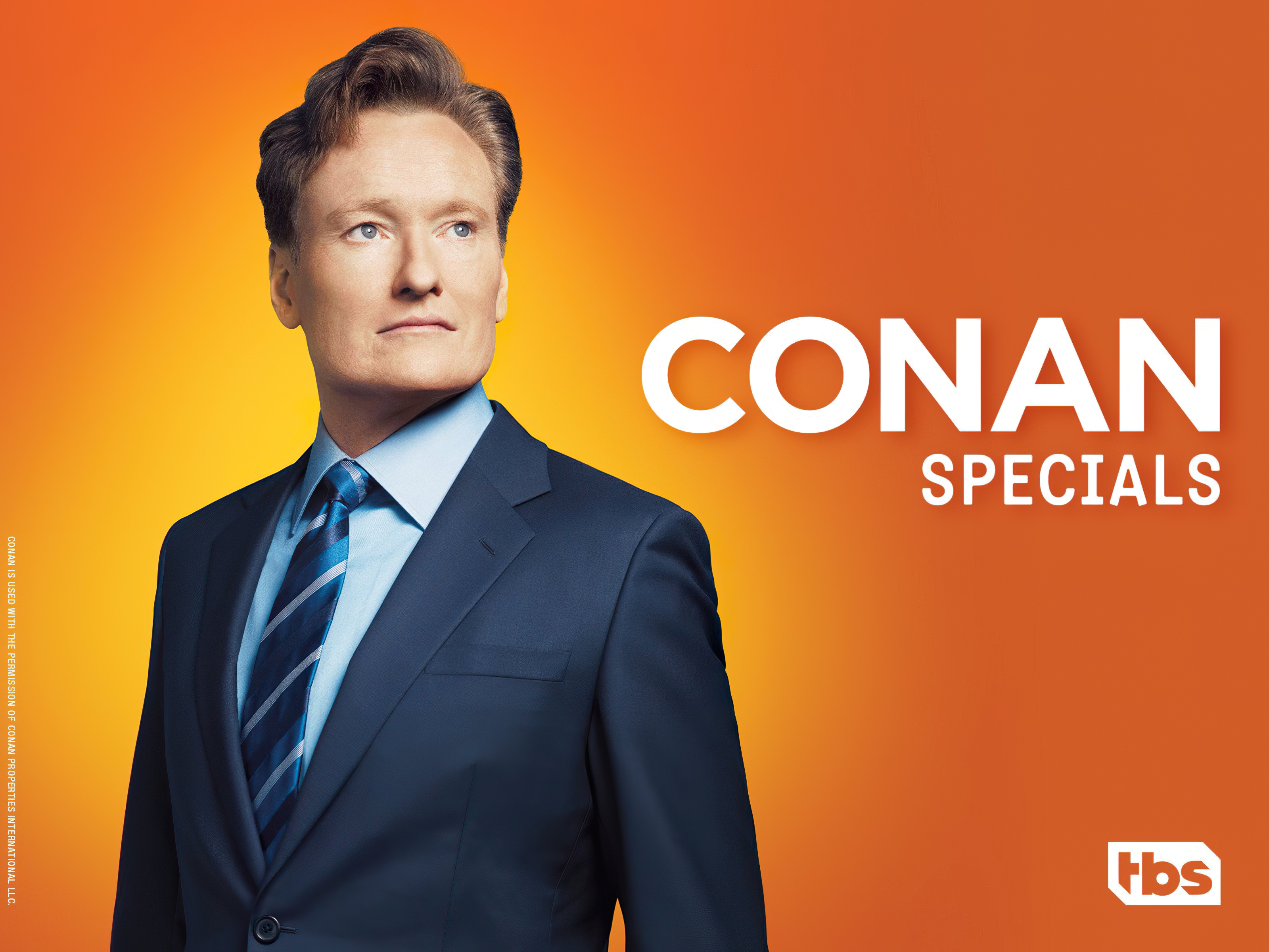 HD desktop wallpaper featuring a promotional image for Conan specials with a distinguished man in a dark suit on an orange background.