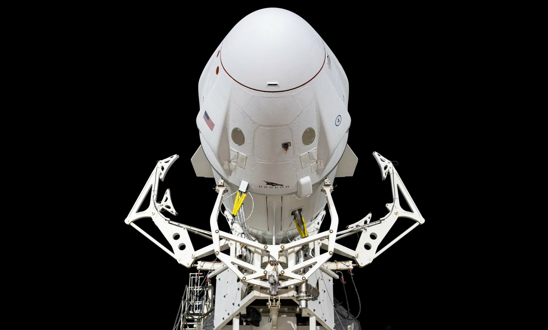 SpaceX Crew Dragon spacecraft docked on launch pad, HD desktop wallpaper.