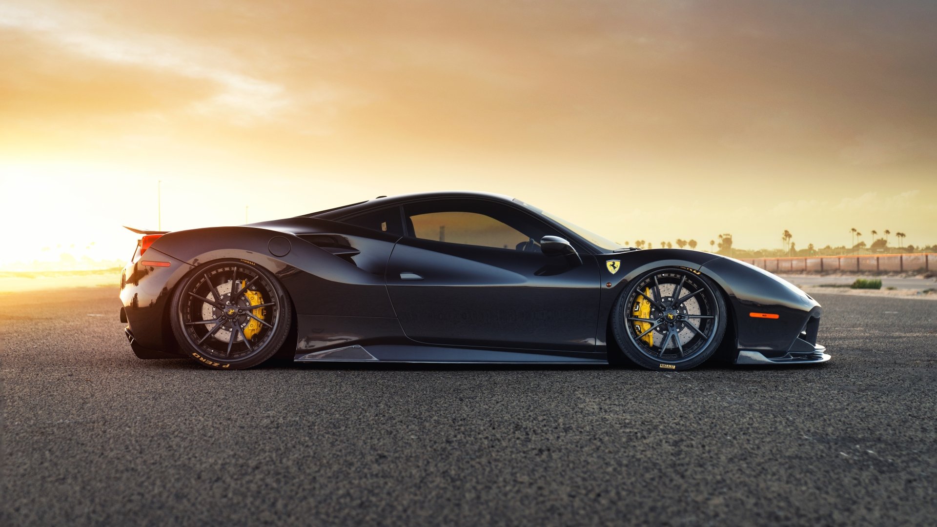 Black Ferrari 488 GTB Siracusa supercar side profile on tarmac at sunset, 8K Ultra HD PC desktop wallpaper background.