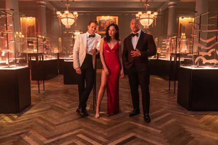 HD desktop wallpaper featuring Gal Gadot, Ryan Reynolds, and Dwayne Johnson dressed elegantly in a luxurious setting from the movie Red Notice.