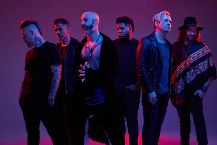 HD desktop wallpaper of the band Daughtry with Chris Daughtry, posing dramatically against a vibrant purple background.