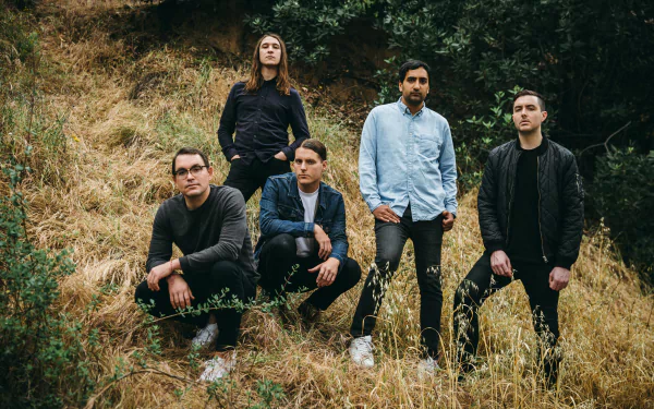 HD desktop wallpaper of Deafheaven band members posing together outdoors against a natural backdrop.