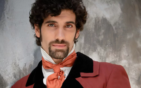 Gentleman with curly hair in historical costume for HD desktop wallpaper and background.