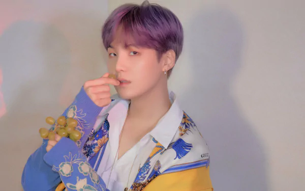 4K Ultra HD desktop wallpaper featuring Suga (Min Yoongi) from BTS, a K-pop singer known for his music and unique style.