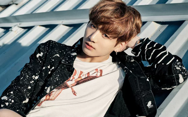 HD PC desktop wallpaper background: a male K-pop singer reclining against metal beams in a casual jacket with soft lighting — a music-themed fan portrait.