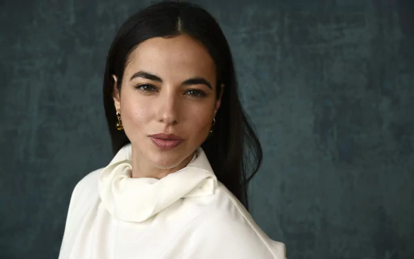 Elegant woman in a stylish white blouse posing against a textured dark background - HD desktop wallpaper and background.