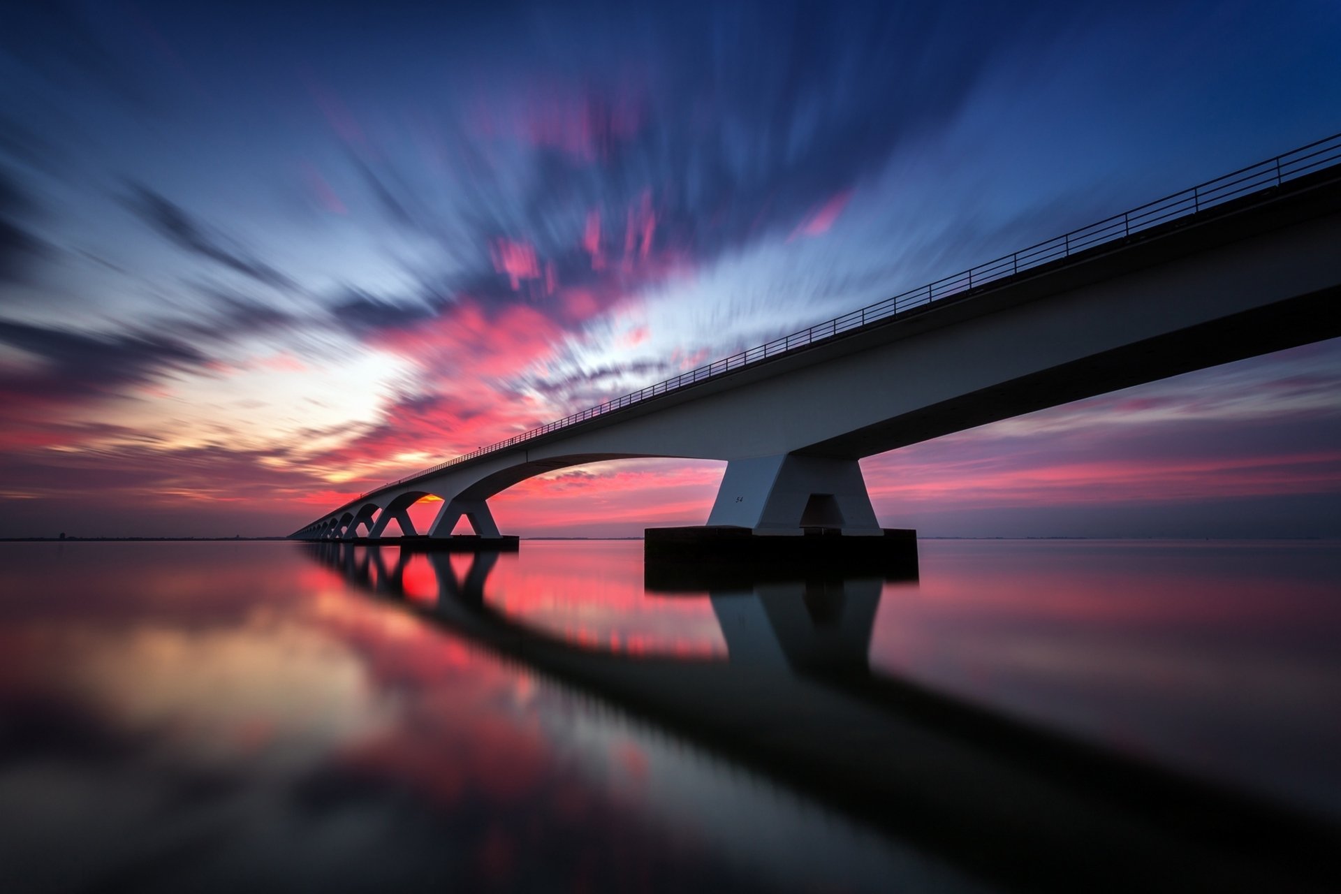 Download Netherlands Zeeland Bridge Sunset Reflection Man Made Bridge HD Wallpaper