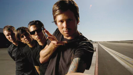 HD desktop wallpaper of Angels and Airwaves band members posed on a runway background.