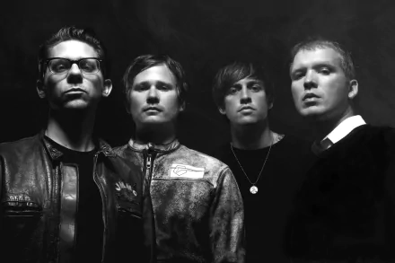 HD desktop wallpaper featuring the band Angels and Airwaves posing dramatically in monochrome.
