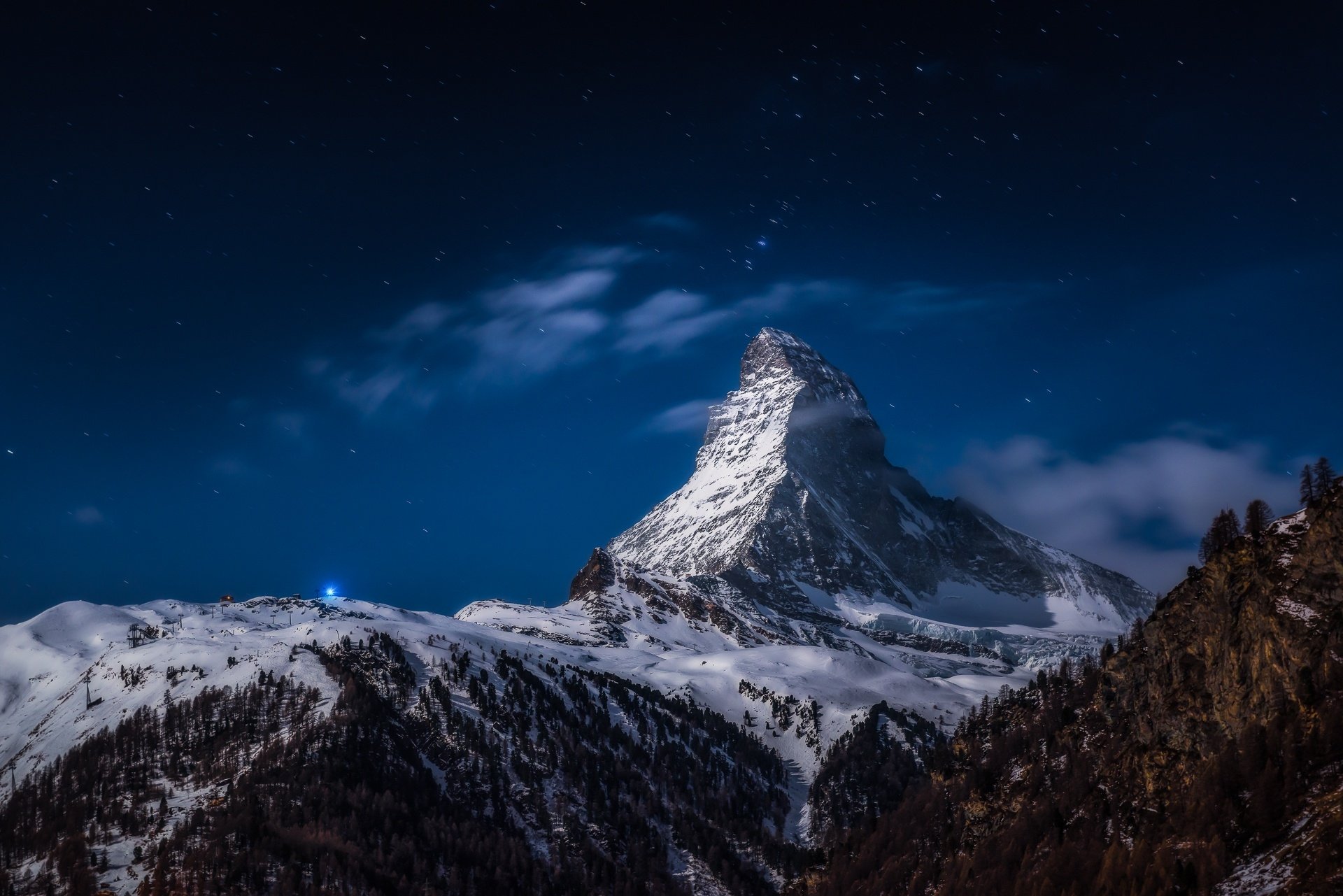 Snow-covered Matterhorn peak in the Alps under a starry night sky, captured in stunning HD for a PC desktop wallpaper background.