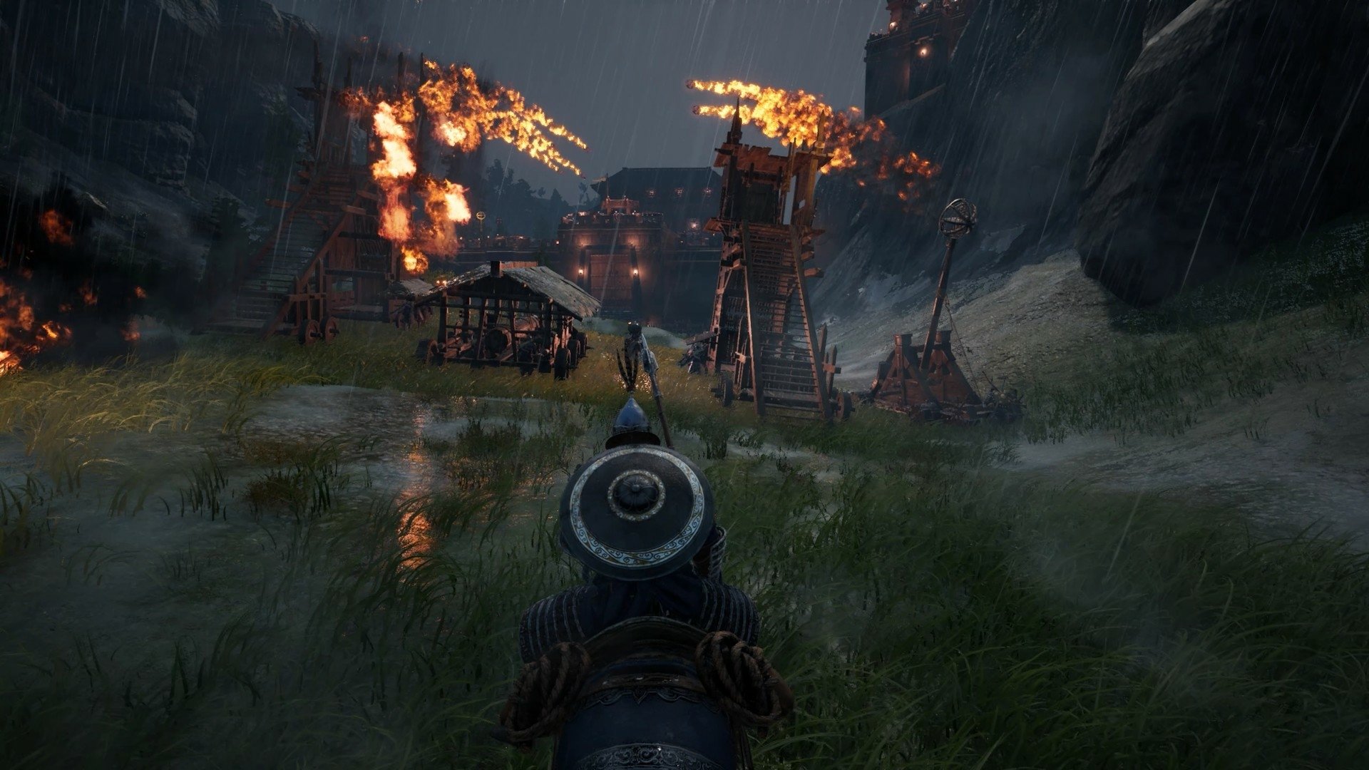 HD Myth of Empires desktop wallpaper featuring a dynamic siege scene with burning towers and a warrior's perspective in the rain.