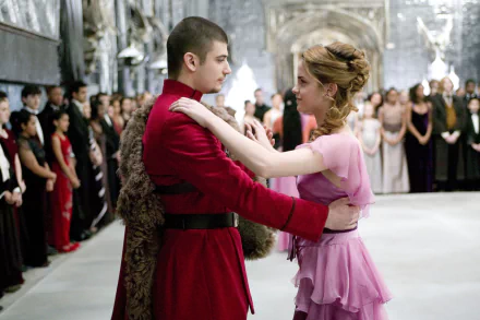 Viktor Krum and Hermione Granger dancing at the Yule Ball from Harry Potter and the Goblet of Fire — HD desktop wallpaper showing a formal ballroom scene.