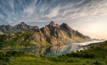 4K Ultra HD nature landscape featuring rugged mountains reflected in calm water under a dramatic sky, captured as a PC desktop wallpaper and background.