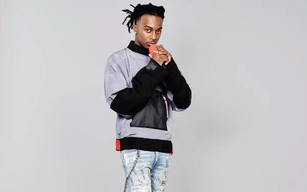 HD desktop wallpaper featuring a stylish individual posing confidently, suitable as a background, tagged with Playboi Carti.