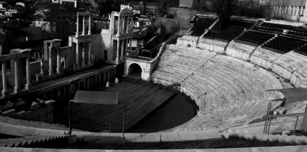 Black & White landscape photography of an ancient stone amphitheater, high-contrast 2K Quad HD PC desktop wallpaper/background.