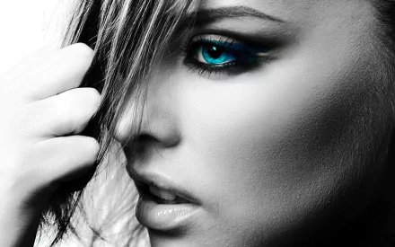 HD PC desktop wallpaper featuring a close-up black-and-white portrait of a woman with striking blue eyes.