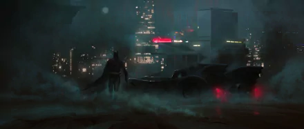 A dark, atmospheric 4K Ultra HD PC wallpaper featuring Batman standing beside the Batmobile against a foggy cityscape, inspired by comic visuals.