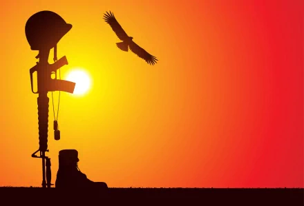 Silhouette of a soldier's rifle and helmet beside a boot against a vibrant sunset, symbolizing remembrance of a fallen soldier, complemented by a soaring eagle. HD desktop wallpaper.
