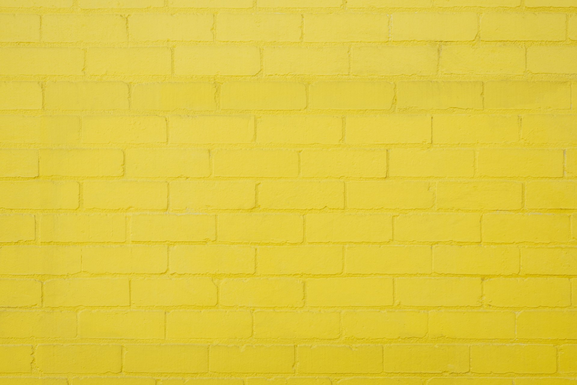 Yellow Brick Wall Background by i360orlando