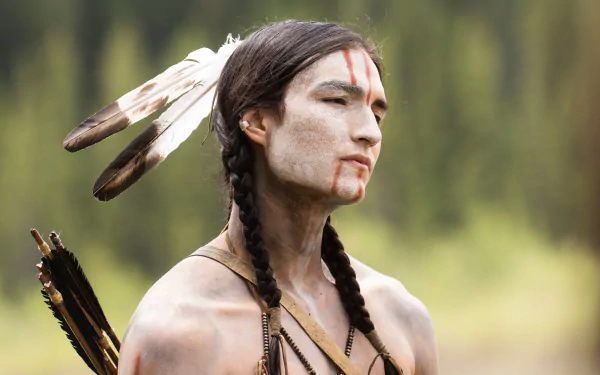 Dakota Beavers in character from the 2022 movie Prey, depicted in a detailed 4K Ultra HD PC desktop wallpaper with natural forest background.