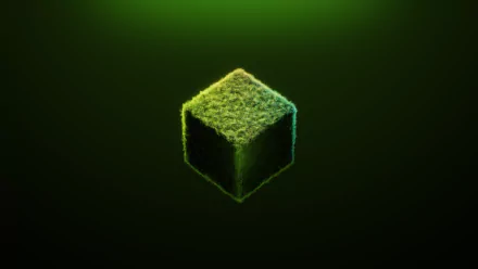HD desktop wallpaper featuring a glowing, grass-covered cube from the video game Minecraft against a dark green background.