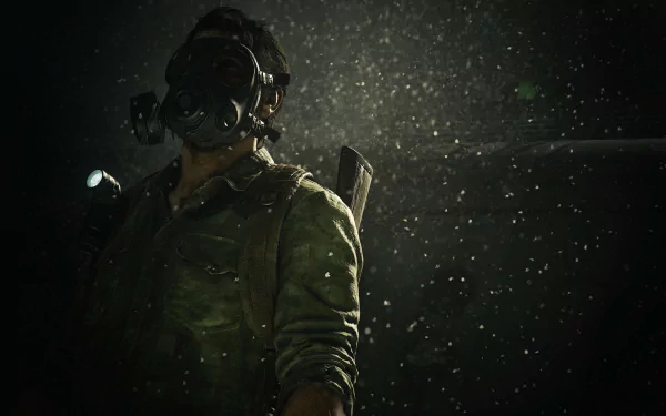 HD PC desktop wallpaper featuring Joel (The Last of Us) from the video game The Last of Us Part I: a rugged survivor in a gas mask with flashlight, rain and dust illuminated against a dark backdrop.