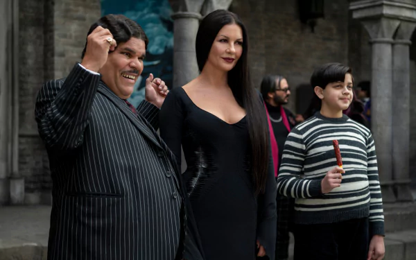 A group portrait featuring Gomez and Morticia Addams, Wednesday, portrayed by Catherine Zeta-Jones, and a new character played by Luis Guzman.