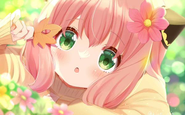 HD PC desktop wallpaper featuring Anya Forger from the anime Spy x Family, showcasing her with green eyes, pink hair, and flowers in a bright, colorful setting.