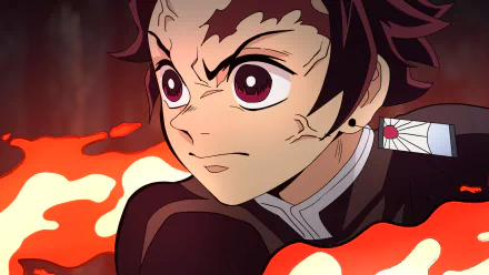 HD anime desktop wallpaper featuring Tanjiro Kamado from Demon Slayer: Kimetsu no Yaiba with intense expression and fiery background.