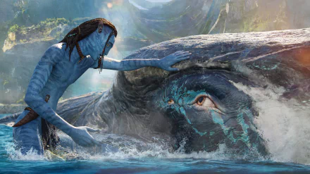 HD PC desktop wallpaper from the movie Avatar: The Way of Water, showing a Na’vi character gently touching the head of a large aquatic creature in a glowing, water-filled environment.