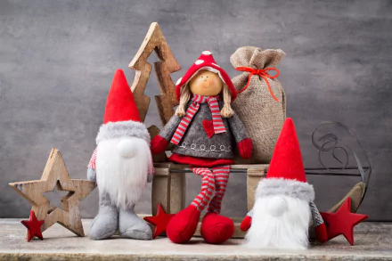 Christmas-themed 4K Ultra HD PC wallpaper featuring festive gnome dolls, a doll in holiday attire, wooden stars, a reindeer, and a rustic gift sack against a gray backdrop.
