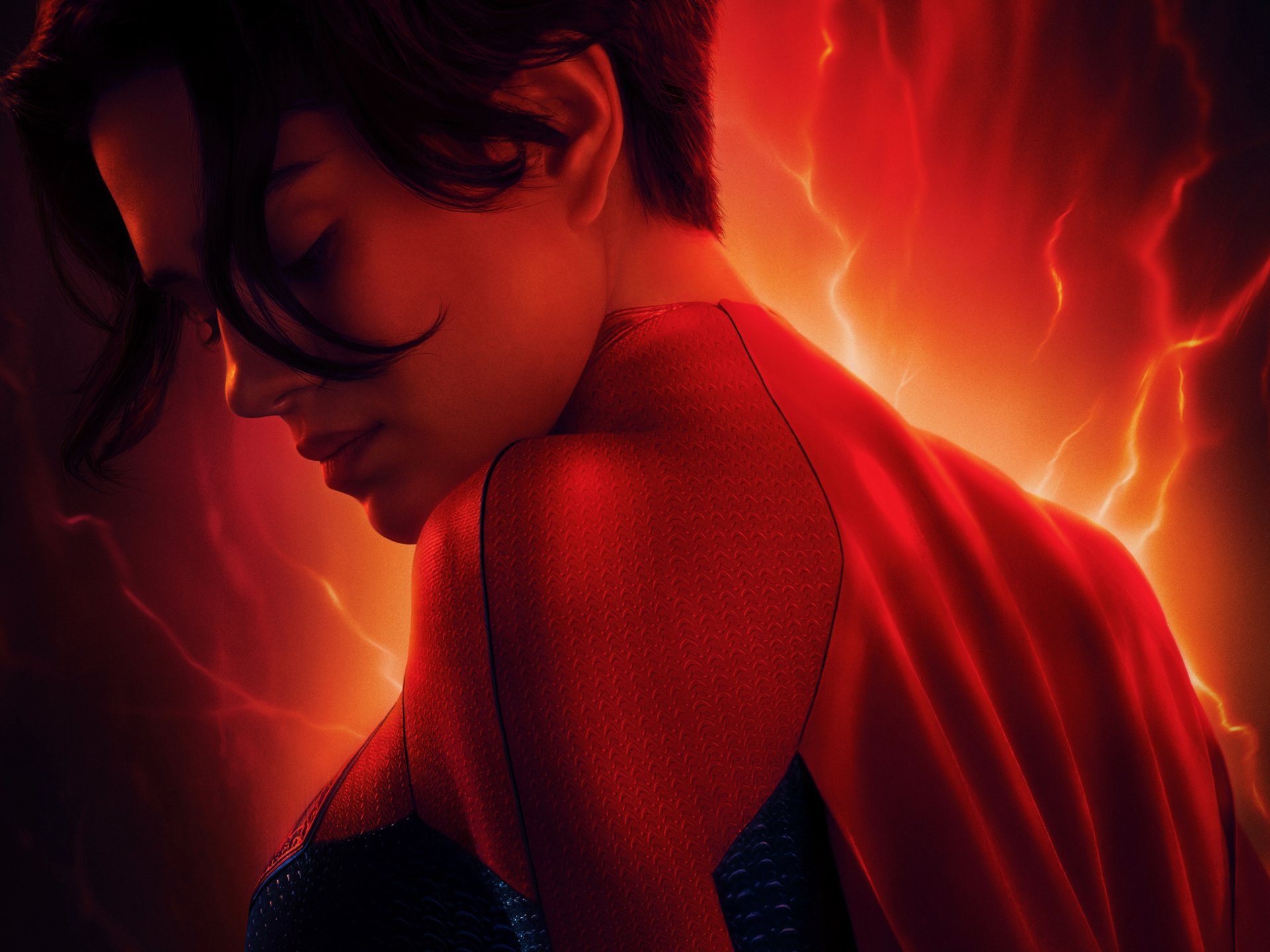 HD PC desktop wallpaper featuring Sasha Calle as Supergirl from the 2023 movie The Flash, with a striking fiery red and orange background.