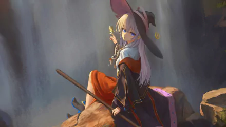 4K Ultra HD anime wallpaper featuring Elaina, the witch from Wandering Witch: The Journey of Elaina, sitting on rocks with her broomstick in a softly lit cavern.