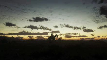 Silhouette of Arthur Morgan riding a horse at morning dawn in Red Dead Redemption 2, captured in stunning 4K Ultra HD for PC desktop wallpaper.