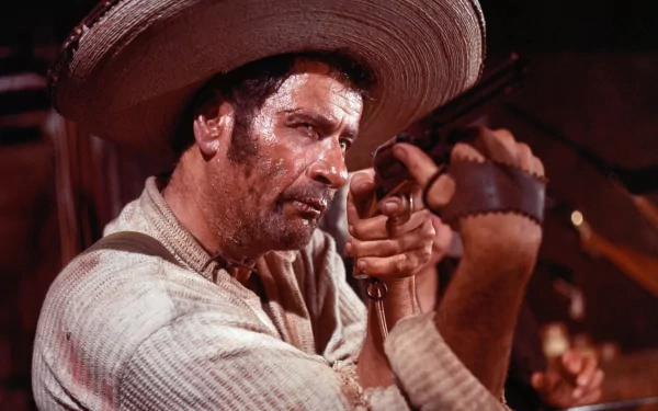 Eli Wallach in a striking scene from The Good, the Bad and the Ugly, showcasing his intense character with a gun, against a dramatic western backdrop in this HD wallpaper.