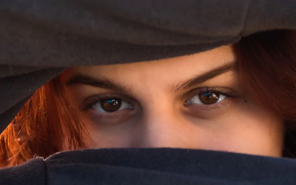 A close-up of a woman's eye in high-definition desktop wallpaper and background.