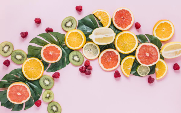 A vibrant display: assortment of fresh fruits set against a teal and white backdrop in an HD desktop wallpaper and background.