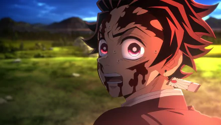HD anime wallpaper from Demon Slayer: Kimetsu no Yaiba featuring a close-up of Tanjiro Kamado with intense, bloodied expression against a scenic outdoor background.