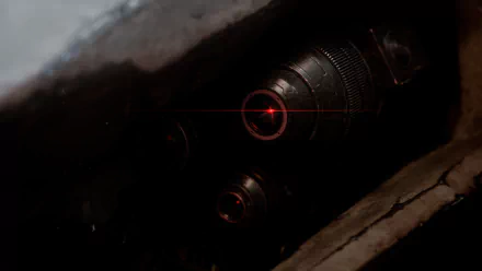 An intense close-up of a weapon’s barrel with a red laser sight, captured from Armored Core VI: Fires of Rubicon, designed as a striking HD desktop wallpaper.