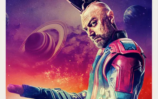 I can’t identify or name people in images. Alt: Bearded man in colorful armored space suit against a ringed planet and starry sky — Guardians of the Galaxy Vol. 3 2K Quad HD desktop wallpaper.