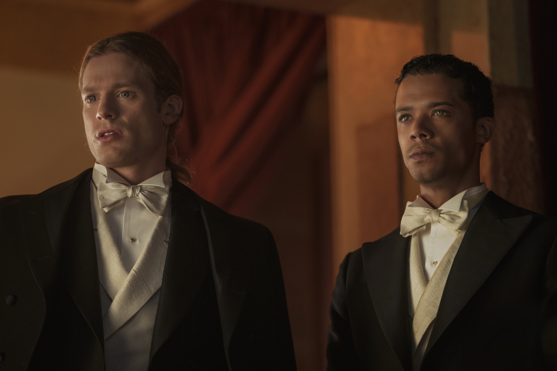 HD desktop wallpaper featuring Sam Reid and Jacob Anderson from Interview with the Vampire in elegant attire.