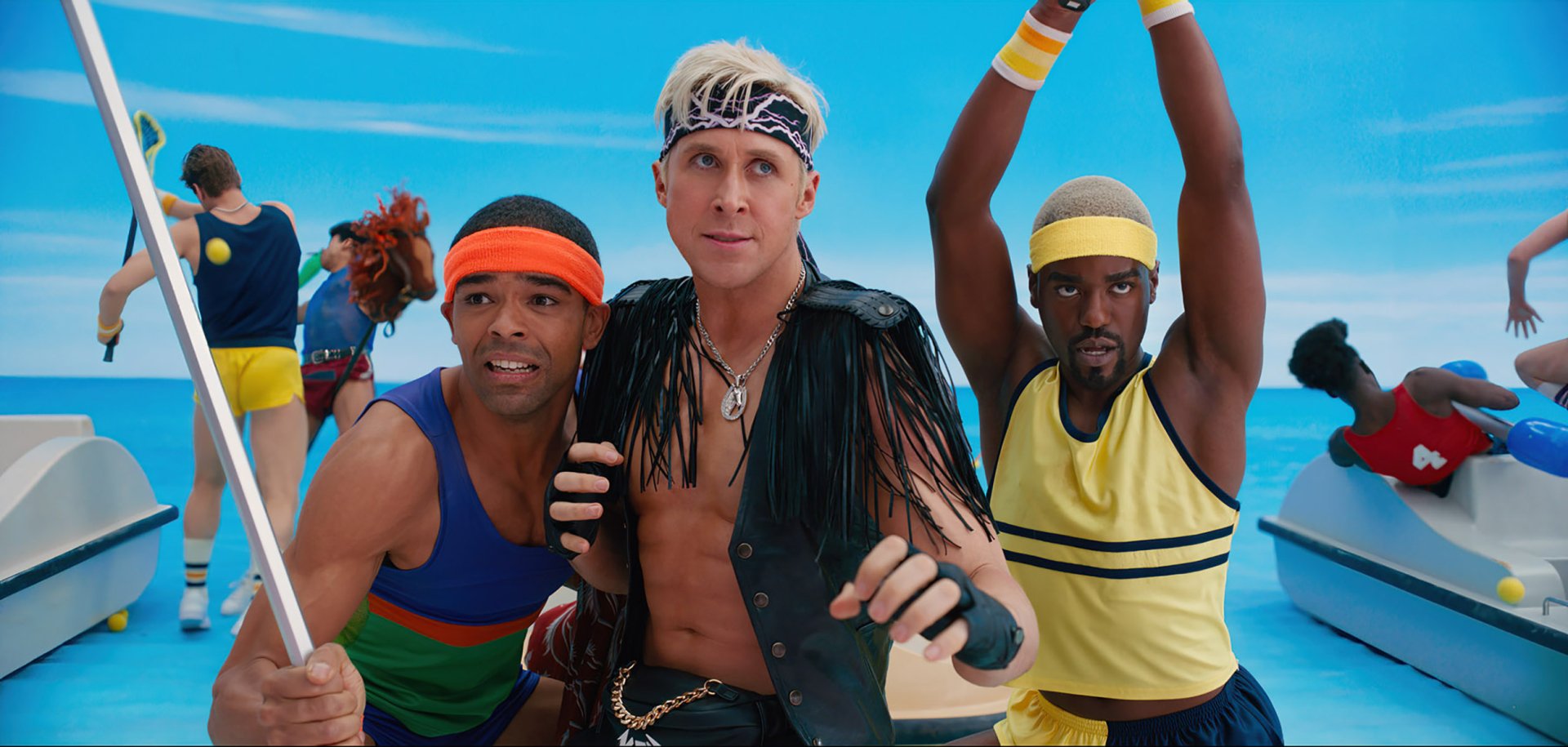 HD desktop wallpaper featuring three actors in vibrant 80's style sportswear for the Barbie 2023 movie, posing against a sky blue backdrop.
