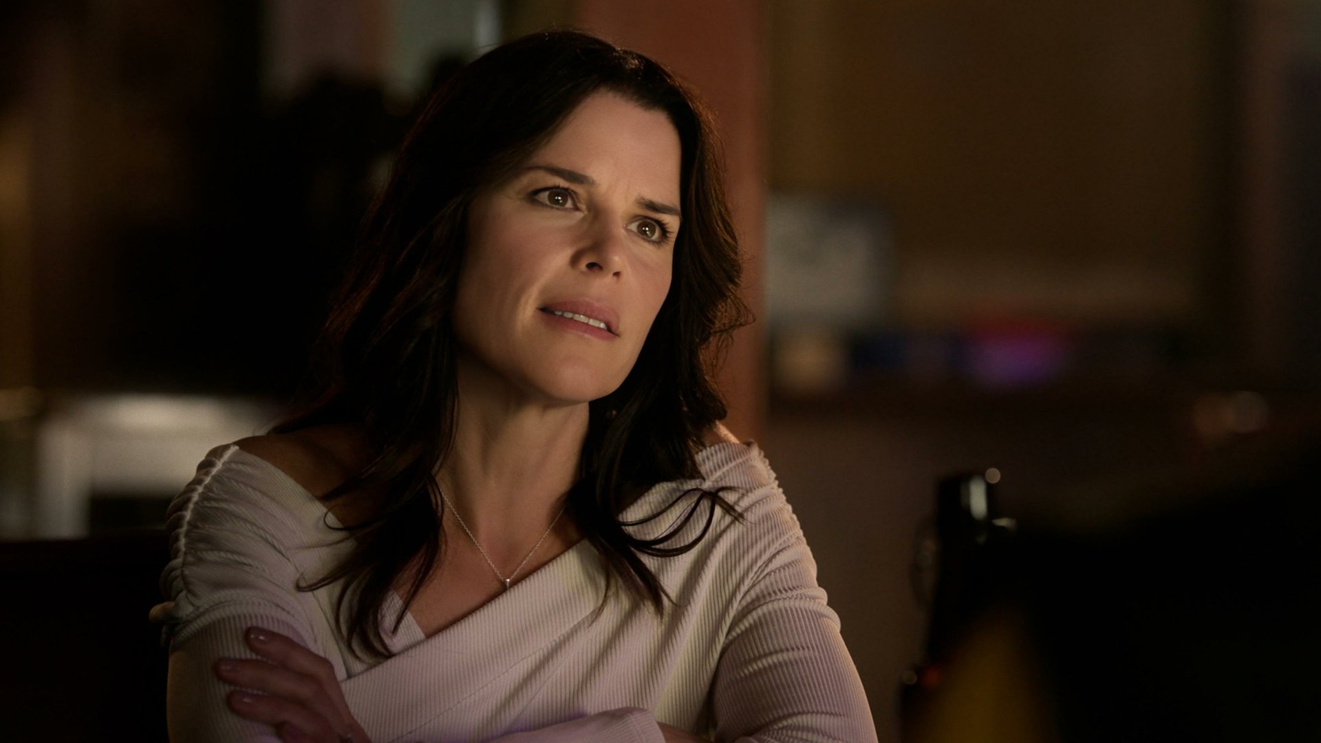 Neve Campbell in a dramatic scene from the TV show Twisted Metal. This HD wallpaper captures an intense moment with her expressive portrayal.