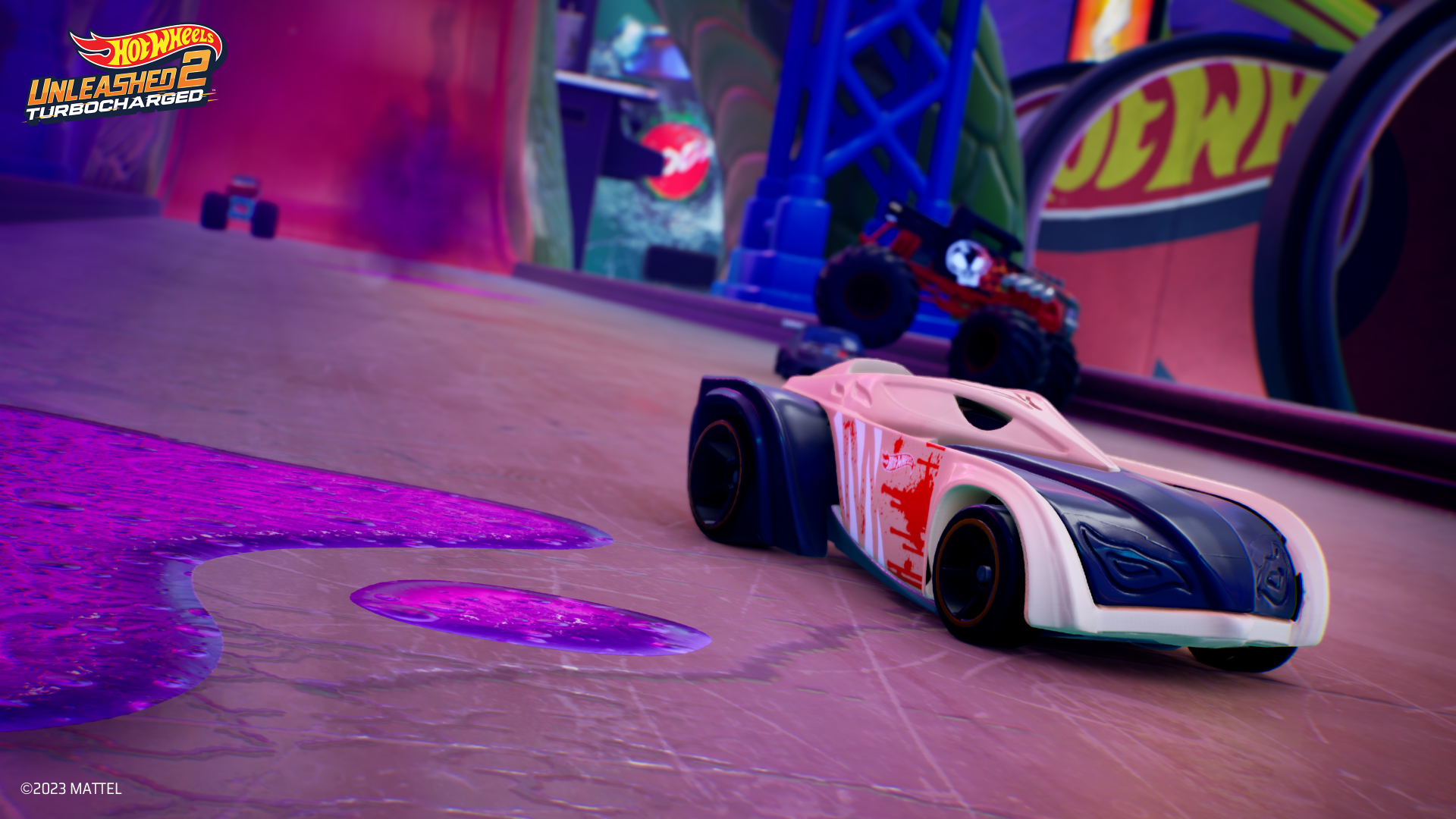 HD desktop wallpaper from Hot Wheels Unleashed 2: Turbocharged, featuring dynamic toy cars racing on a vibrant track.