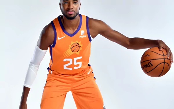 HD wallpaper featuring Mikal Bridges in an orange Phoenix Suns basketball uniform, holding a basketball, against a white background.