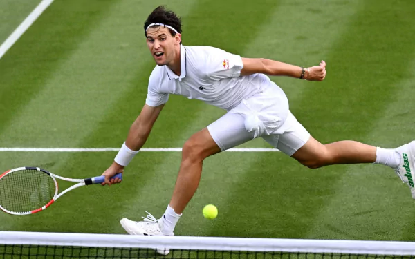 Tennis player in action on grass court at Wimbledon 2023, HD wallpaper and background.