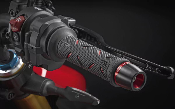 HD wallpaper featuring a close-up detail of the throttle control and handlebar of a Ducati Streetfighter V4 motorcycle.